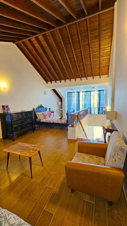 a living room with a couch and a table at Apartamento Terra e Mar II in Ponta Garça