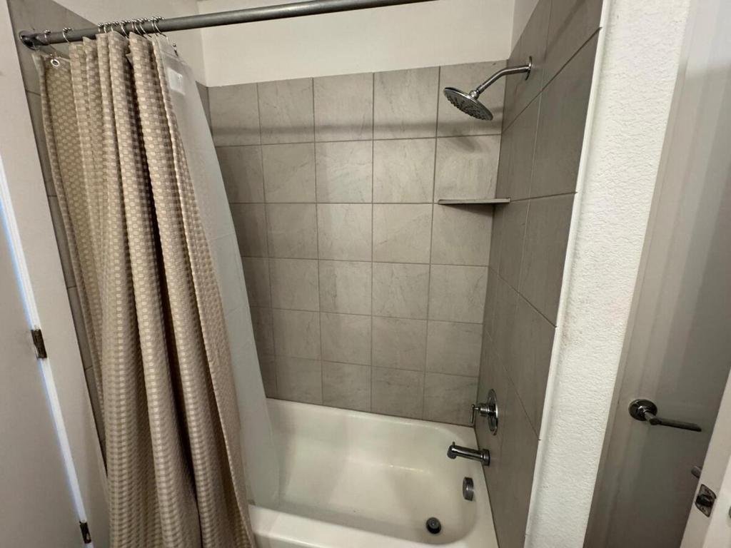 a bathroom with a shower with a shower curtain at cozy apartment in Leander in Leander