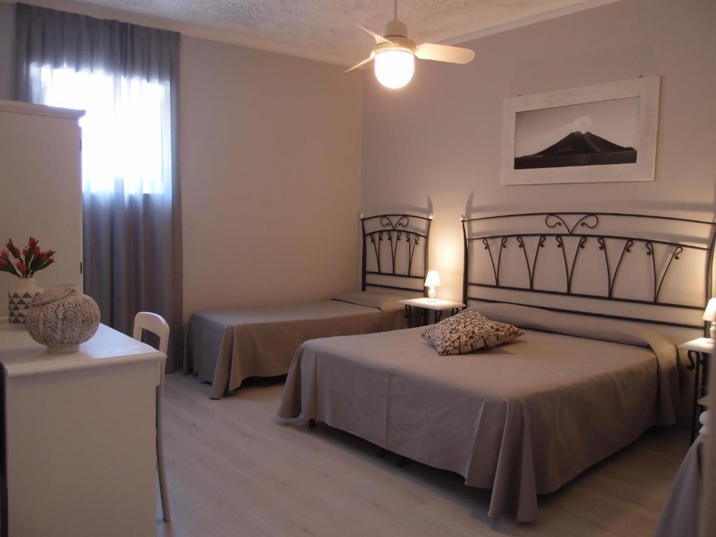 Postel nebo postele na pokoji v ubytování Hotel Odissea