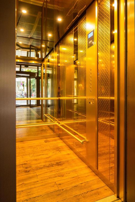 an open door of a building with a wooden floor at Monbijou Hotel in Berlin