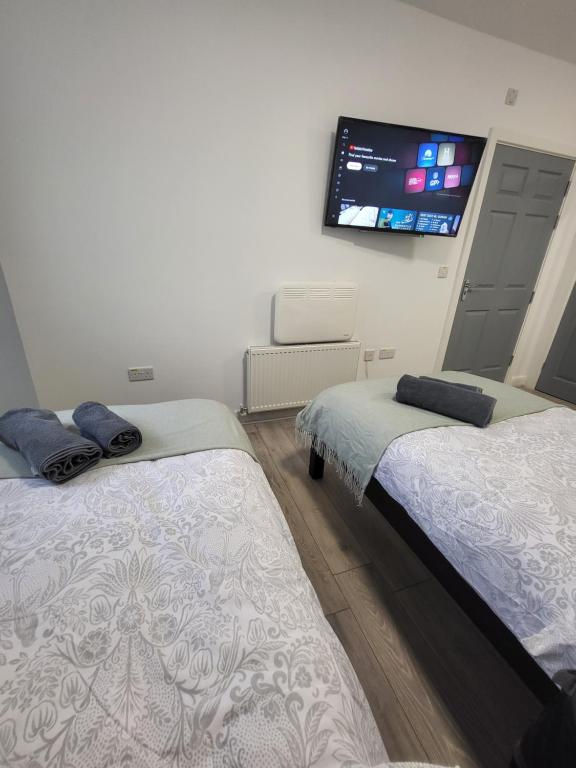 Postel nebo postele na pokoji v ubytování Prime Retreats - Flynn House