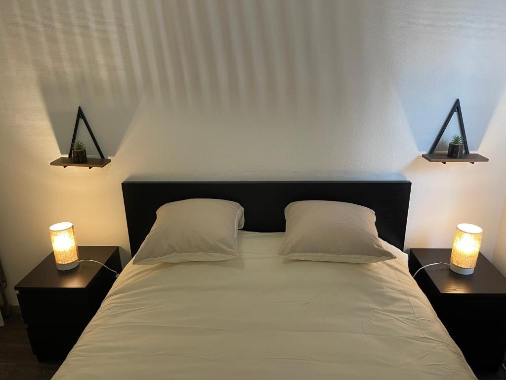 Ένα ή περισσότερα κρεβάτια σε δωμάτιο στο Apartment 2