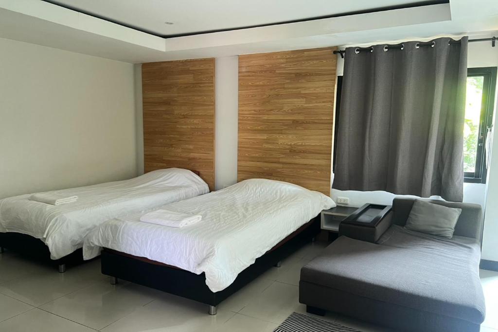 Postel nebo postele na pokoji v ubytování BKL Pool Villa Pattaya