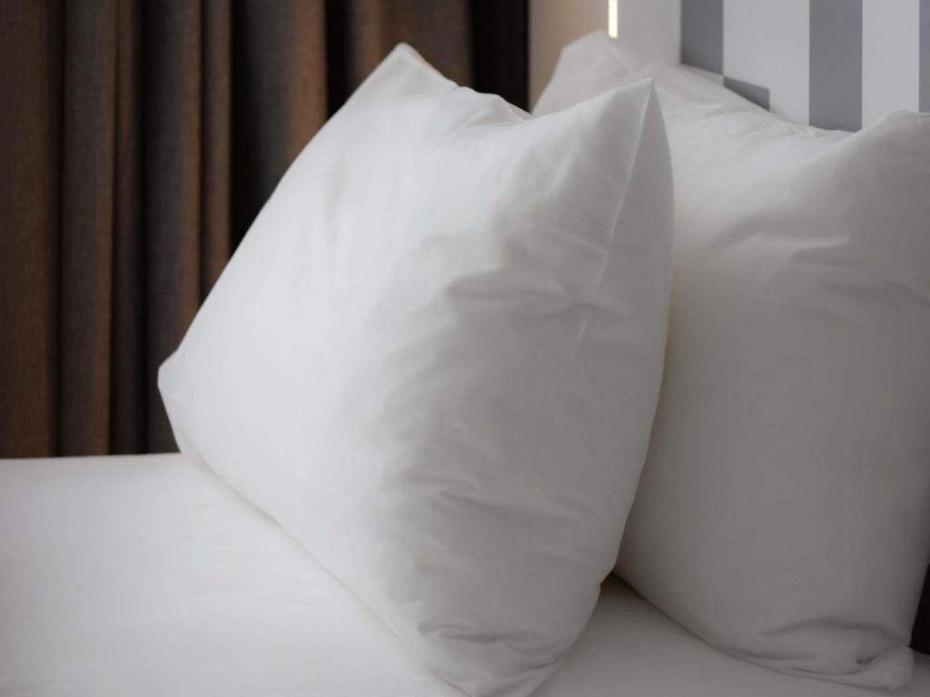 Postel nebo postele na pokoji v ubytování Mercure Béziers