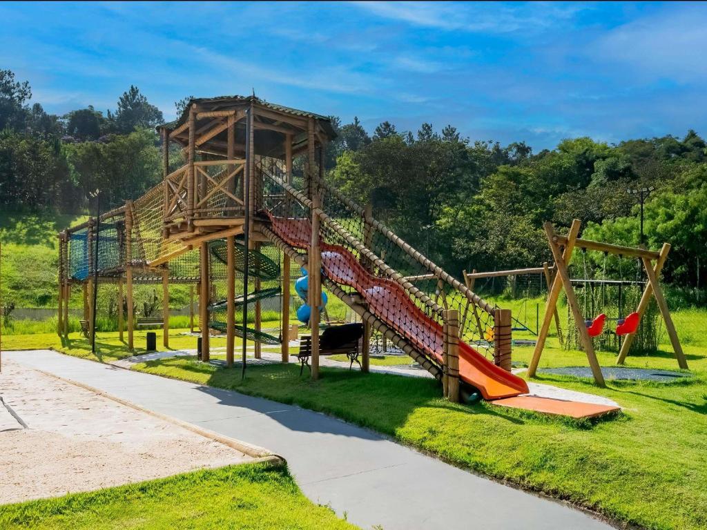 a playground in a park with a slide at Pullman Sao Paulo Guarulhos Airport in Guarulhos