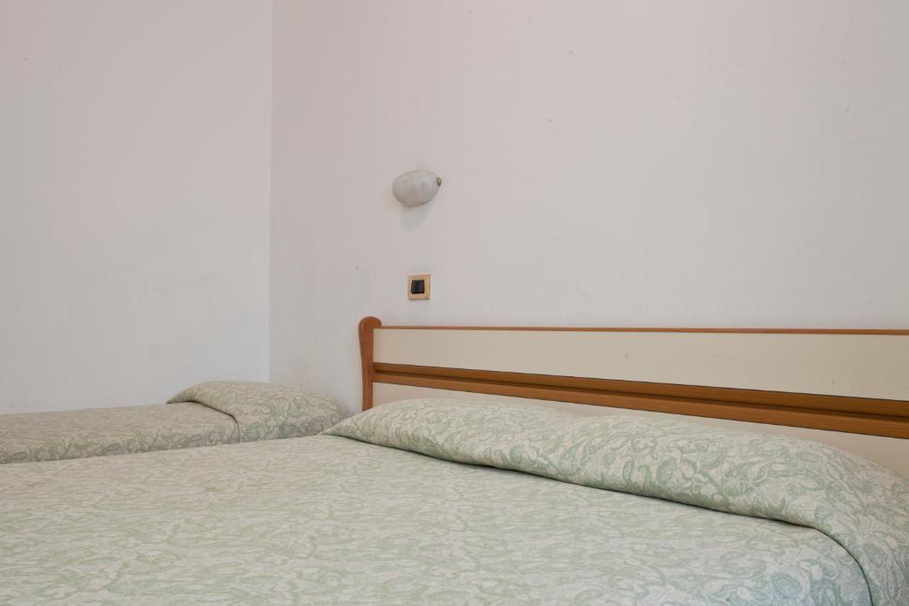Postel nebo postele na pokoji v ubytování Hotel I 4 Assi