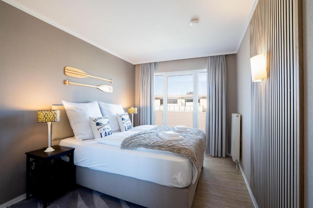 Postel nebo postele na pokoji v ubytování Das Solaris 10 Luxury Beach Apartment mit Balkon, hundefreundlich, individuell