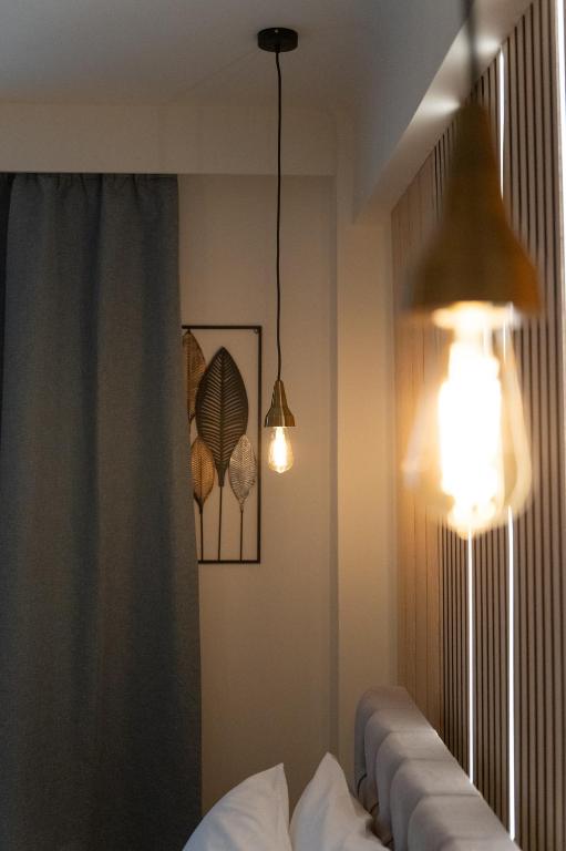 Ένα ή περισσότερα κρεβάτια σε δωμάτιο στο Niki Athens Suites - 404 - Cosy Apartment in Athens Historical Center