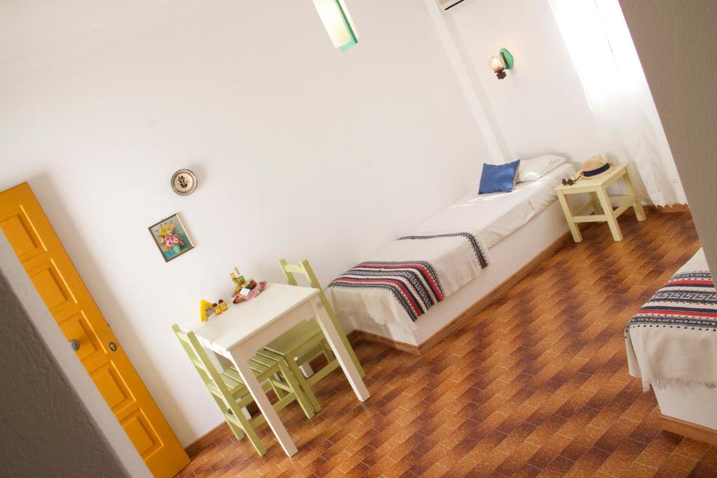 Postel nebo postele na pokoji v ubytování Arokaria Seaside