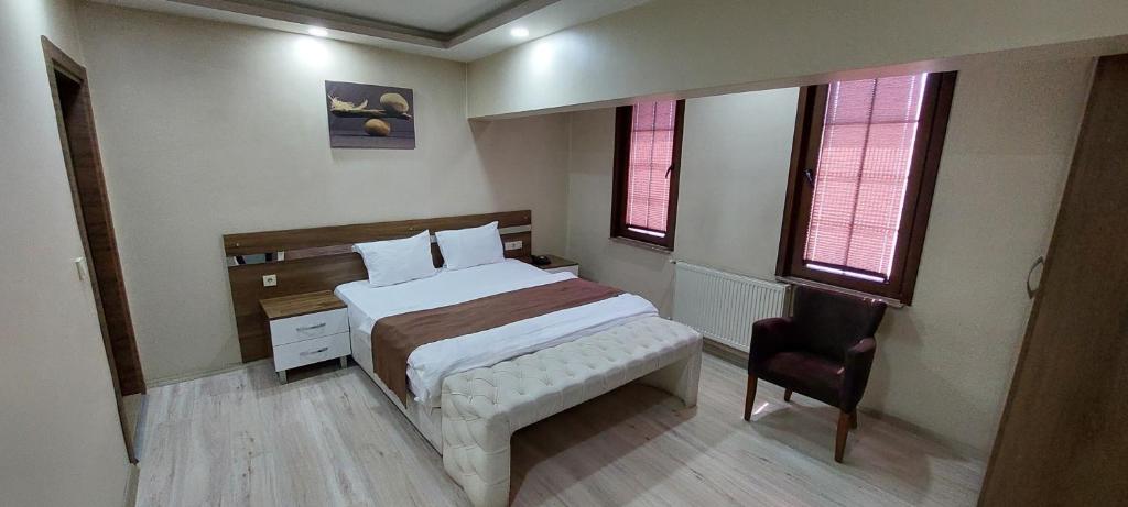 Postel nebo postele na pokoji v ubytování Divrigi Kosk Hotel