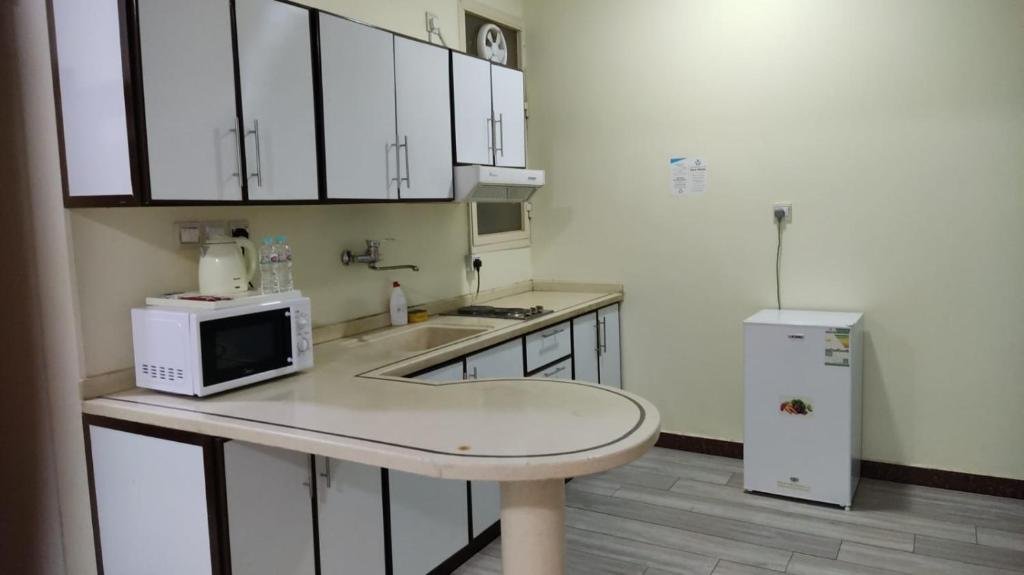 Kuchyň nebo kuchyňský kout v ubytování Open Hotel Buraiyda