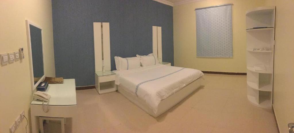 Postel nebo postele na pokoji v ubytování Open Hotel Buraiyda
