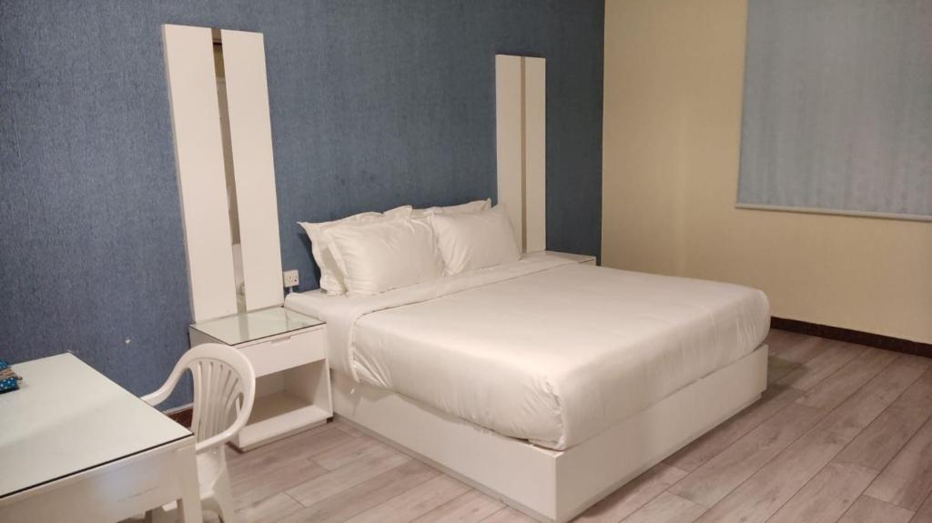 Postel nebo postele na pokoji v ubytování Open Hotel Buraiyda