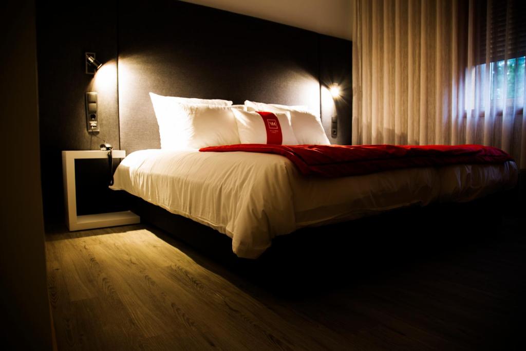 Postel nebo postele na pokoji v ubytování Villa Prime Hotel