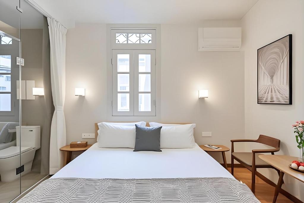 Postel nebo postele na pokoji v ubytování Gulangyu Liuyue Garden Resort Hotel