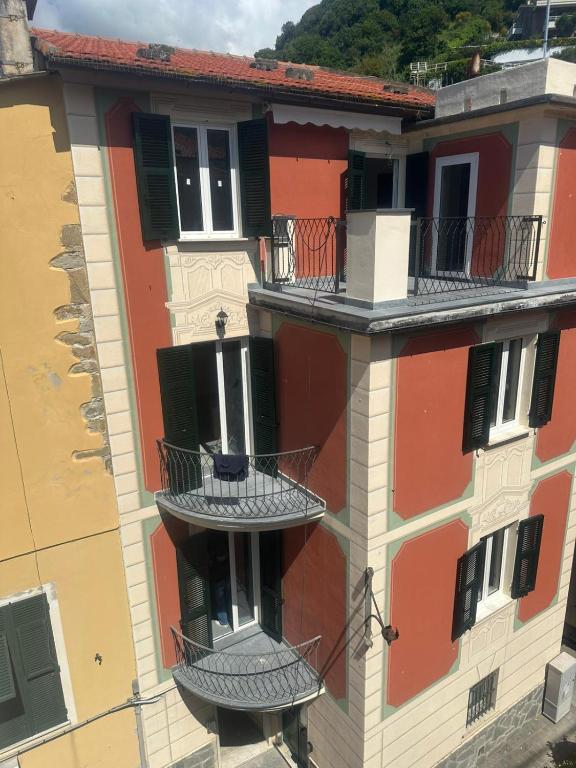 a building with balconies on the side of it at HH Moneglia la Piazzetta in Moneglia