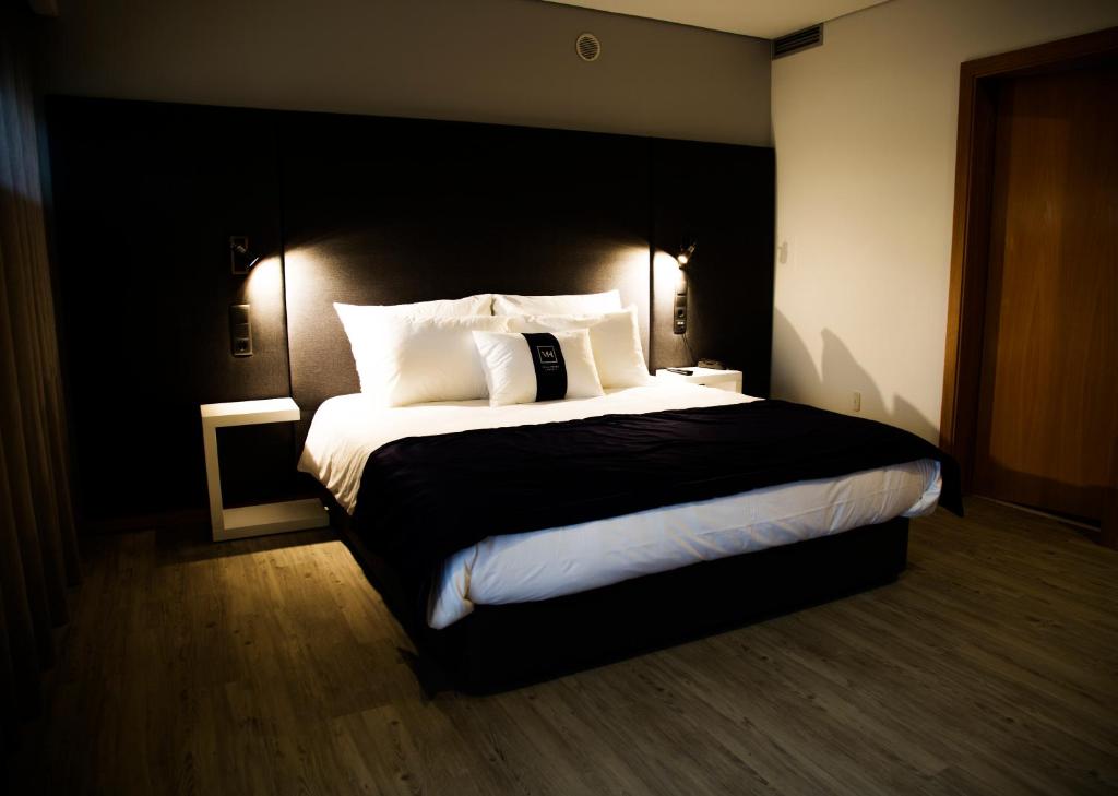 Postel nebo postele na pokoji v ubytování Villa Prime Hotel