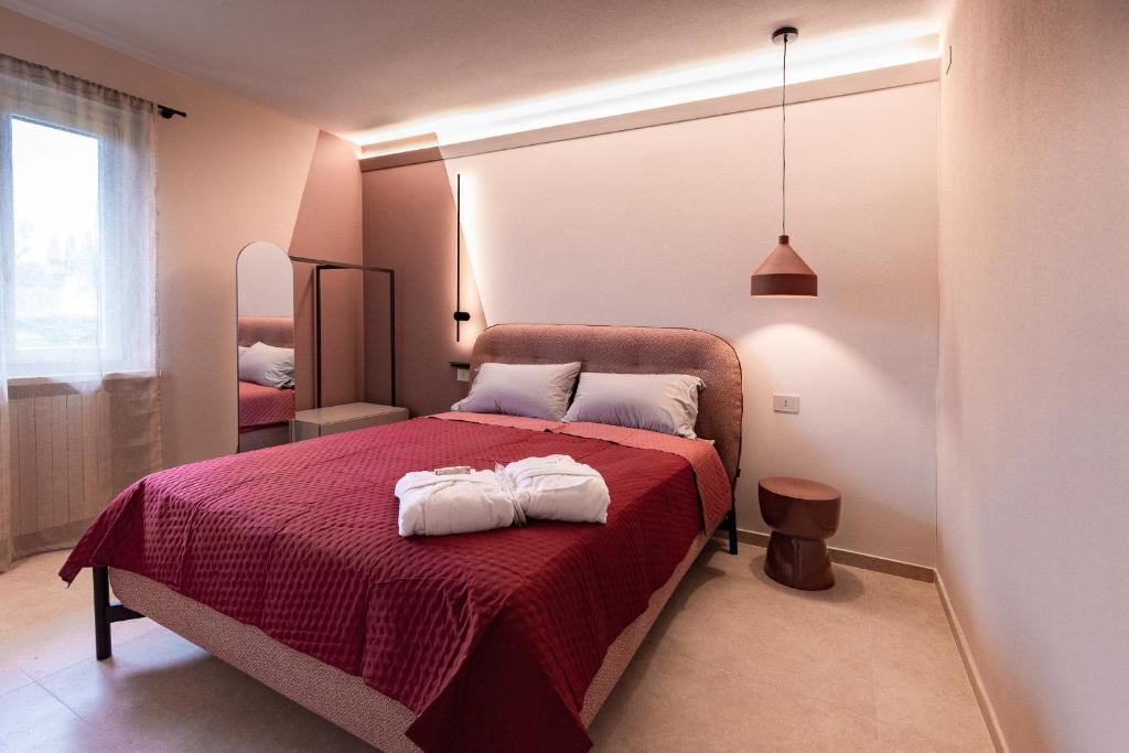 Postel nebo postele na pokoji v ubytování Agriturismo CarpinoNero