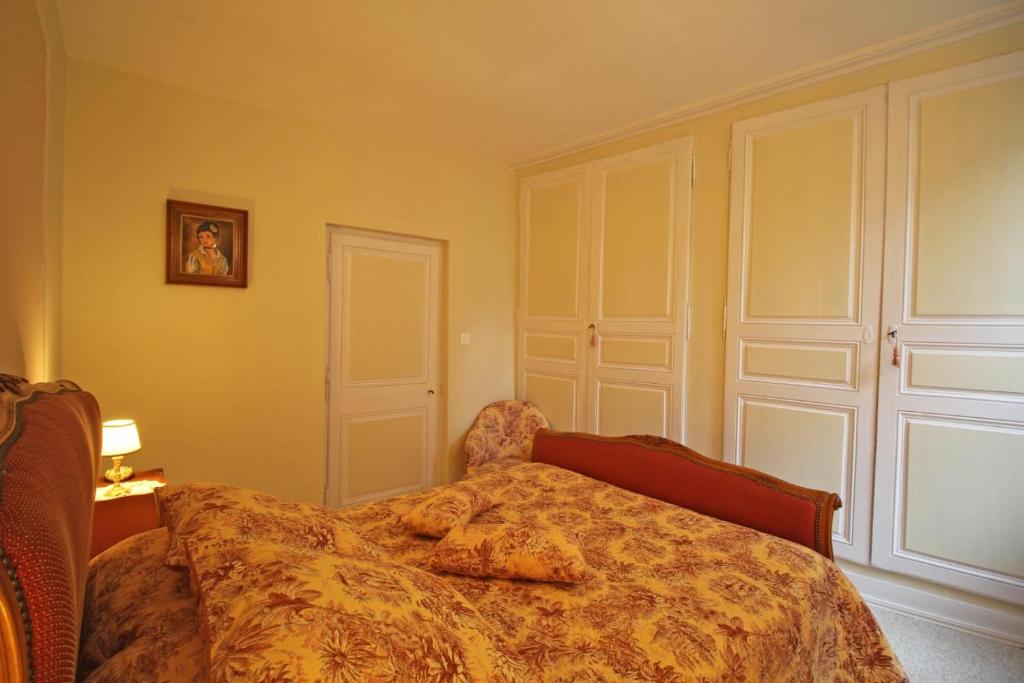 Postel nebo postele na pokoji v ubytování Maison gay lussac