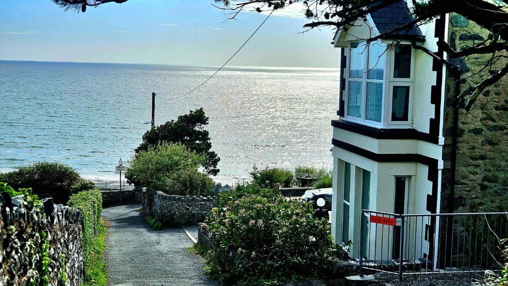 a house with a view of the ocean at Talarfor Barmouth in Barmouth