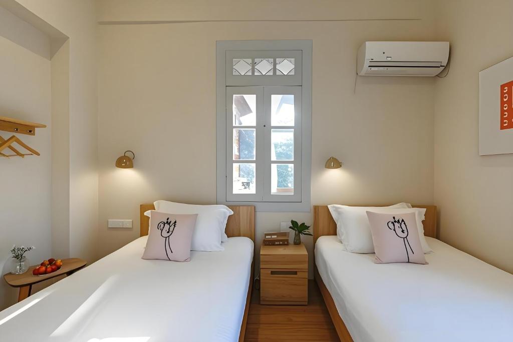 Postel nebo postele na pokoji v ubytování Gulangyu Liuyue Garden Resort Hotel