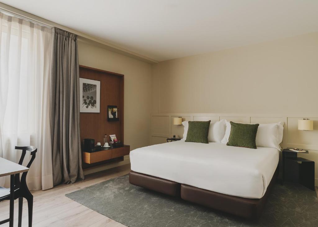 Posteľ alebo postele v izbe v ubytovaní Gallery Hotel 4 Sup