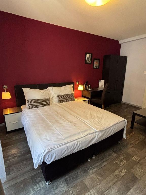 Uma cama ou camas num quarto em Hotel Parc & Lac