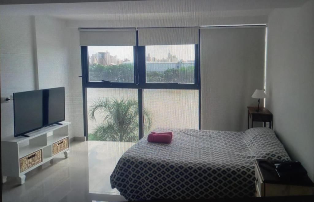 Postel nebo postele na pokoji v ubytování Departamento en Puerto Amarras