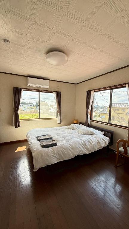 Postel nebo postele na pokoji v ubytování Kitayama Fuji View House