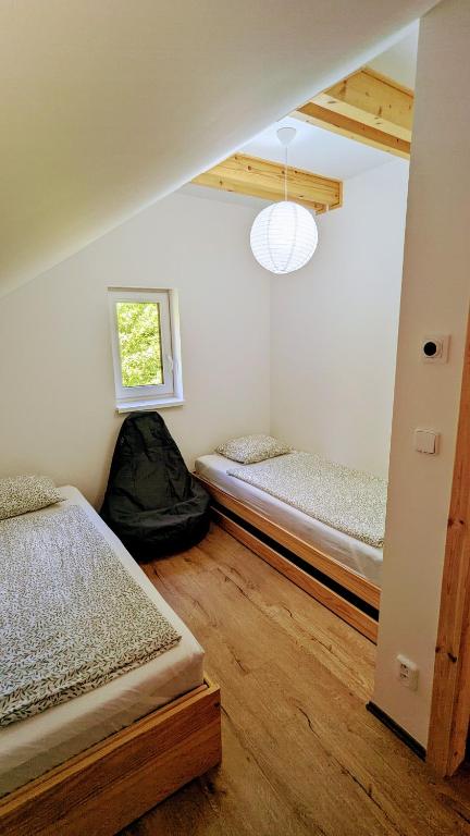 Postel nebo postele na pokoji v ubytování Vila Jedovnice