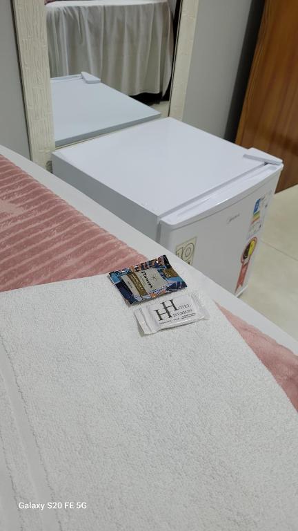 Postel nebo postele na pokoji v ubytování Hotel Hiperion Maringá