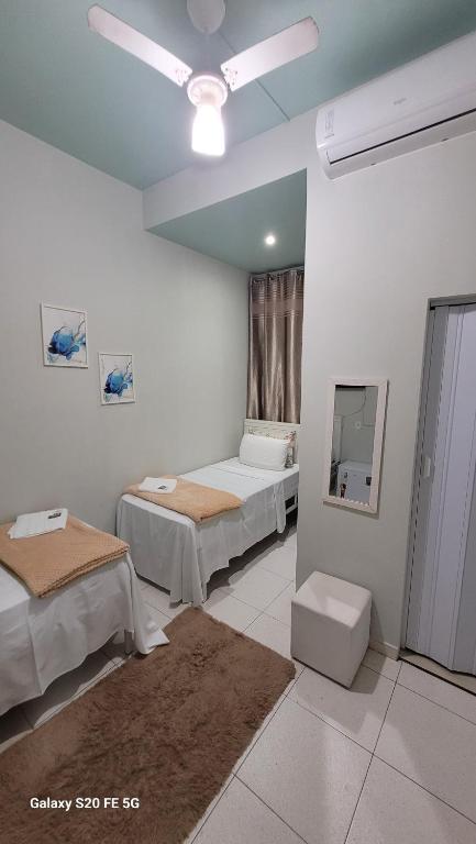 Postel nebo postele na pokoji v ubytování Hotel Hiperion Maringá