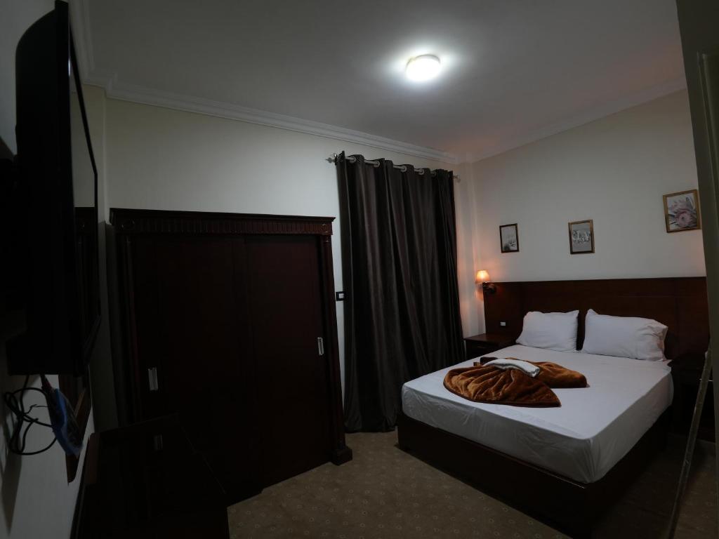 Postel nebo postele na pokoji v ubytování Montana Hotel