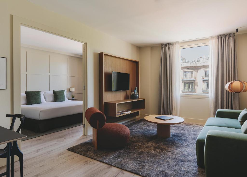Televízia a/alebo spoločenská miestnosť v ubytovaní Gallery Hotel 4 Sup