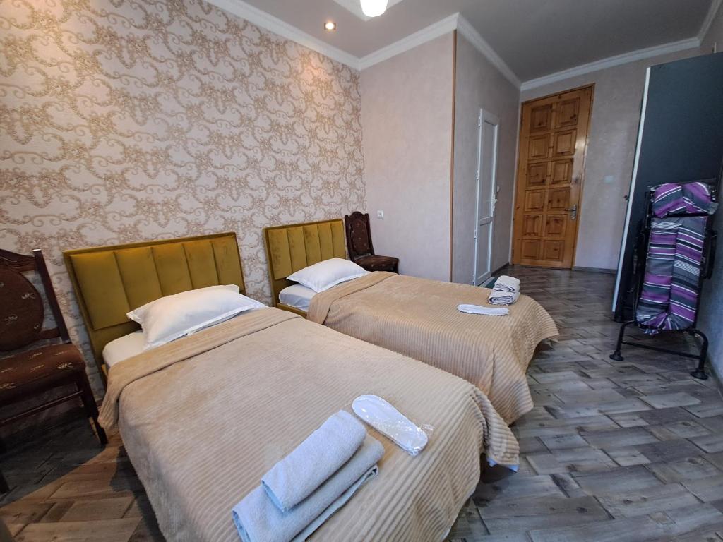 Llit o llits en una habitació de Guest House "AKHALTSIKHE"