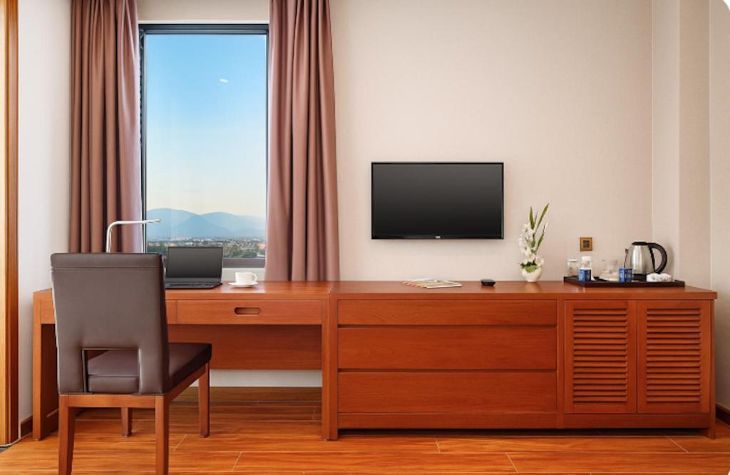 TV a/nebo společenská místnost v ubytování Mercury Boutique Hotel