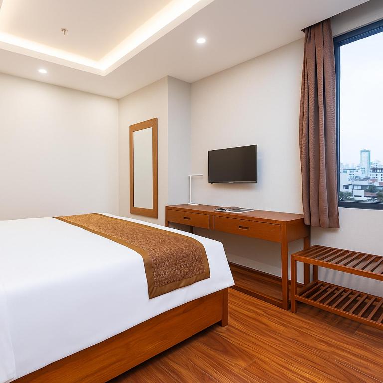 Postel nebo postele na pokoji v ubytování Mercury Boutique Hotel