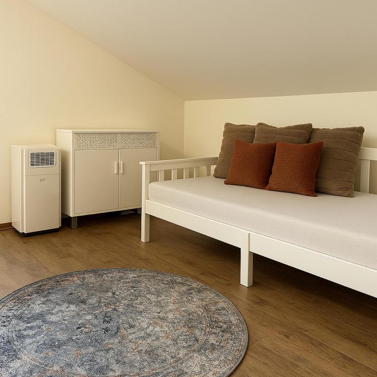 Een bed of bedden in een kamer bij Kantor Village am Millstätter See - Boutique-Chalets und Lodges
