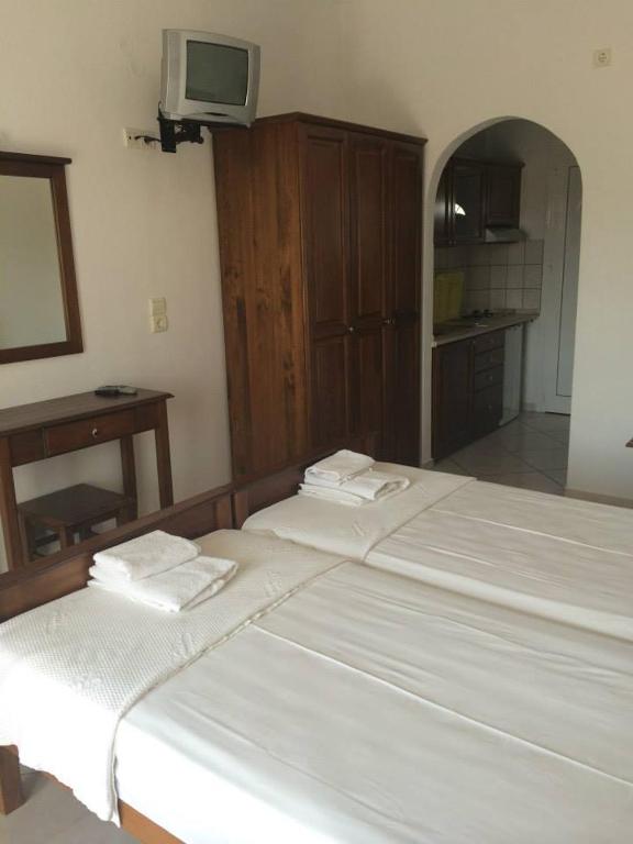 Postel nebo postele na pokoji v ubytování Gogas Palace