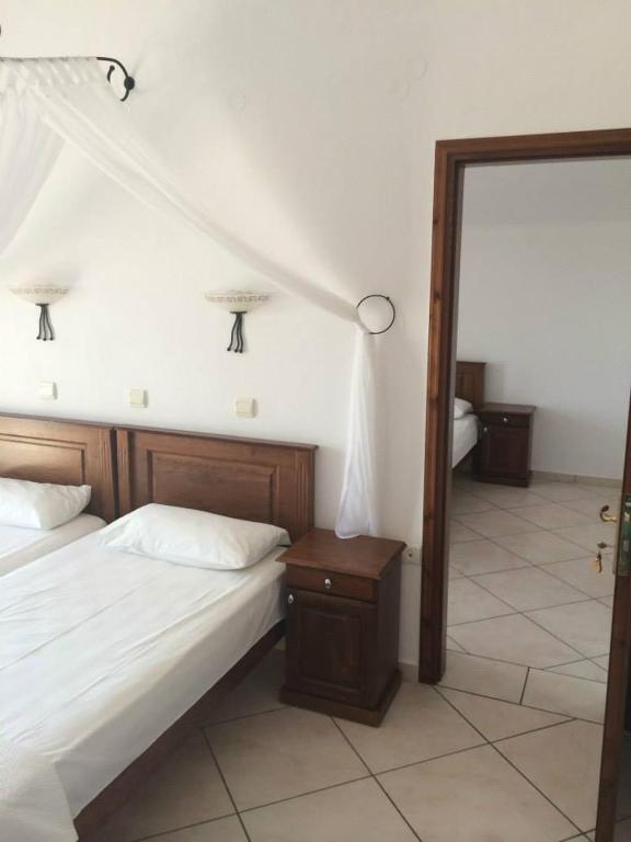 Postel nebo postele na pokoji v ubytování Gogas Palace