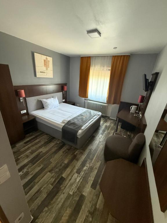 Postel nebo postele na pokoji v ubytování Parkhotel Lindenhof - KOSTENLOSE PARKPLÄTZE