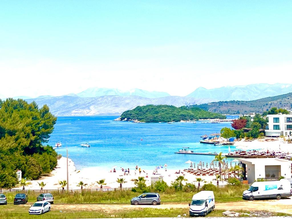 a view of a beach with people in the water at Villa Lions in Ksamil