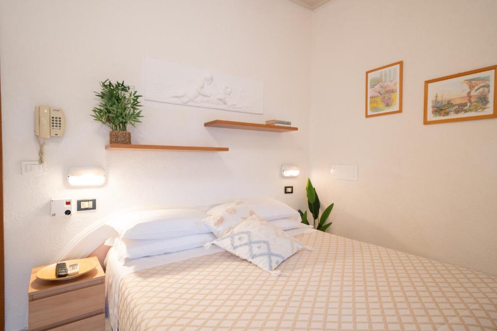 Postel nebo postele na pokoji v ubytování Hotel Continental