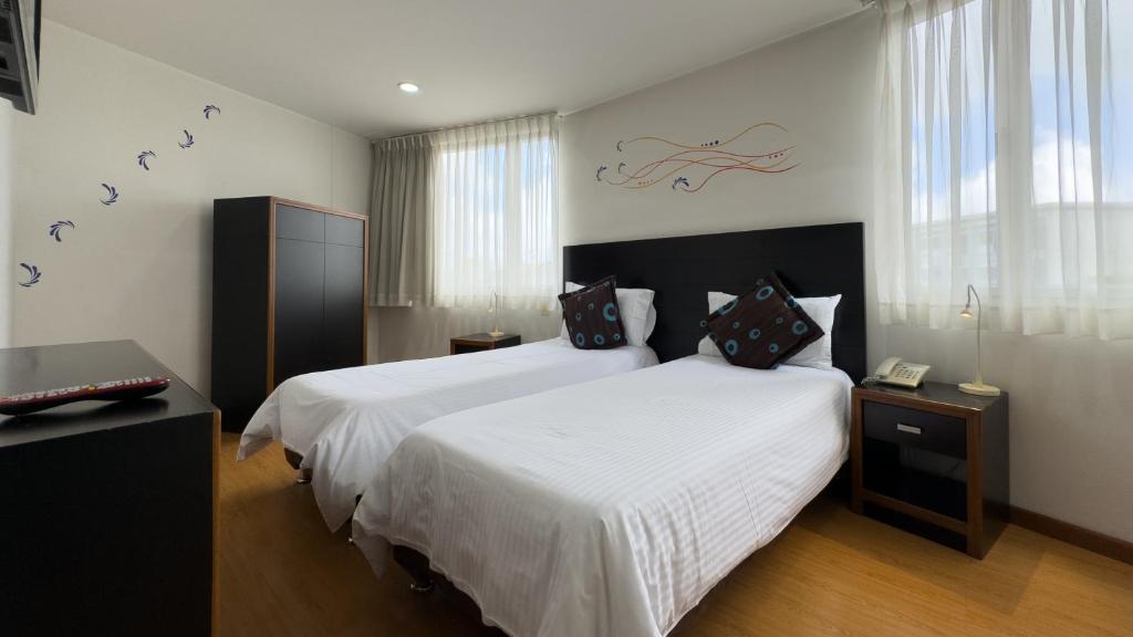 Postel nebo postele na pokoji v ubytování Benidorm Hotel