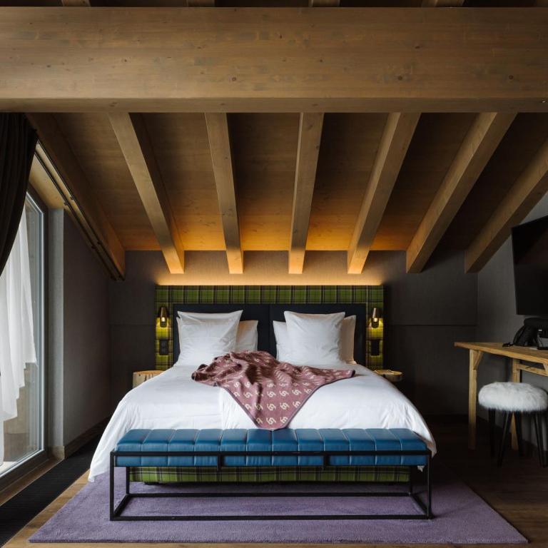 Postel nebo postele na pokoji v ubytování Bergwelt Grindelwald - Alpine Design Resort