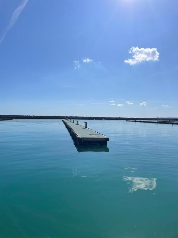 a dock in the middle of a large body of water at Casa Mia Sirolo in Sirolo