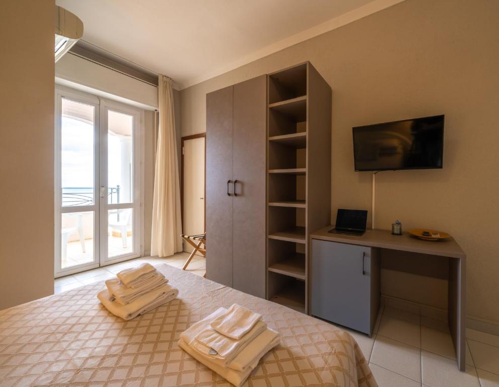 Postel nebo postele na pokoji v ubytování Hotel Continental