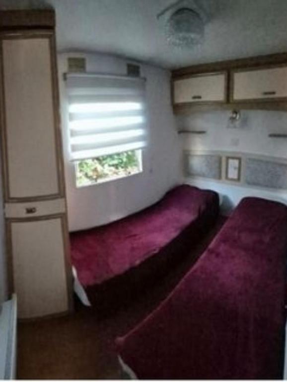Postel nebo postele na pokoji v ubytování Agréable mobil home