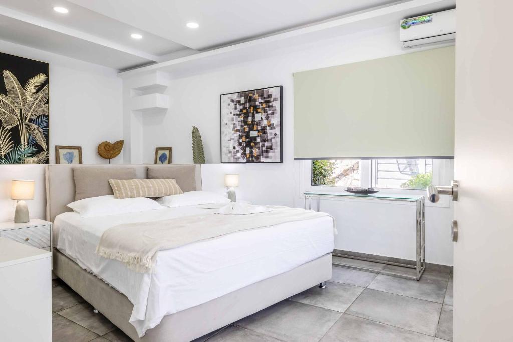 Posteľ alebo postele v izbe v ubytovaní Amare La Vita Villa by Solmar Villas