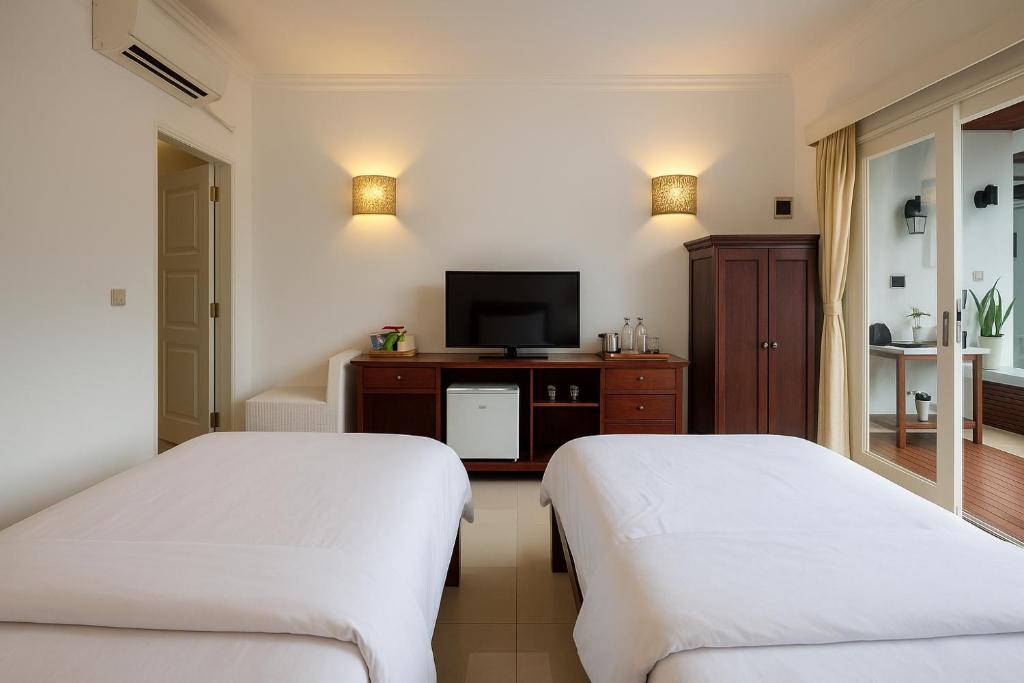 Postel nebo postele na pokoji v ubytování Lumiere Hotel Gili Trawangan